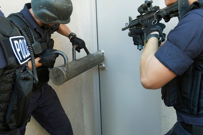 Police-officers-breaking-down-doors