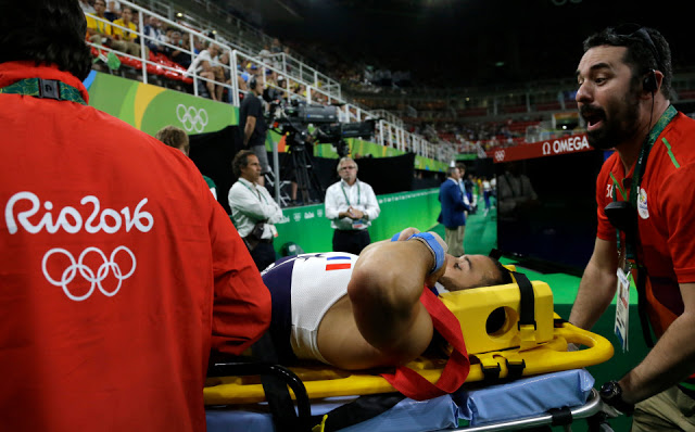 France's Samir Ait Said is carried away on a stretcher after he injured himself while performing on the vault during the artistic gymnastics men's qualification at the 2016 Summer Olympics in Rio de Janeiro, Brazil, Saturday, Aug. 6, 2016. (AP Photo/Julio Cortez)