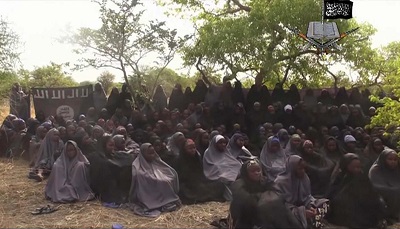In this  photo taken from video  by Nigeria's Boko Haram terrorist network, Monday May 12, 2014 shows the alleged missing girls abducted from the northeastern town of Chibok. The new video purports to show dozens of abducted schoolgirls, covered in jihab and praying in Arabic. It is the first public sight of the girls since more than 300 were kidnapped from a northeastern school the night of April 14  exactly four weeks ago. (AP Photo)