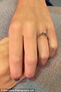 The engagement ring on her finger