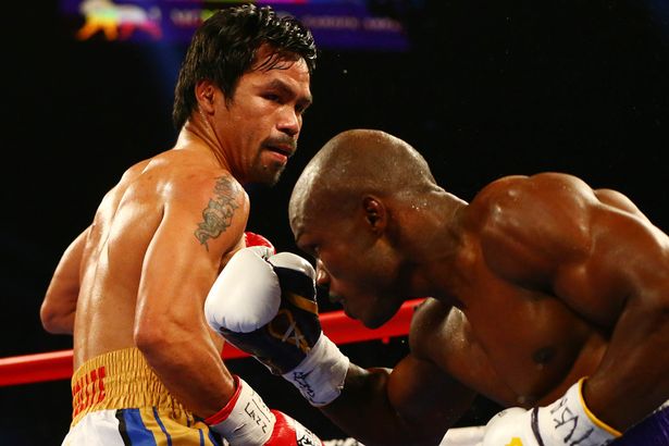 Manny-Pacquiao-moves-in-to-land-a-punch-as-Timothy-Bradley