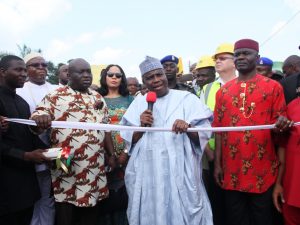  Governor Aminu Waziri of Sokoto State cutting the tape to formally flag off the Umuocham-Umule-Umuehilegbu road built by Abia State government in Aba. With his is Governor Okezie Ikpeazu. 