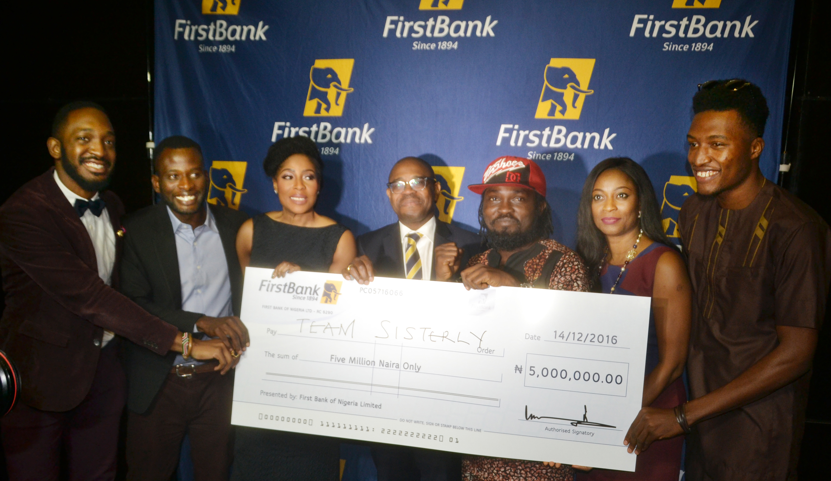  Deputy Managing Director, FirstBank, Gbenga Shobo (Middle); Executive Chairman and CEO of EbonyLife TV, Mo Abudu ( third left); Group Head, Marketing and Corporate Communications, FirstBank, Folake Ani-Mumuney (second right) presenting the star prize to the winners of the FirstBank FirstStars Reality TV show (Team Sisterly) .
