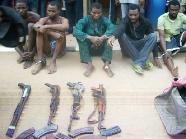 Robbers paraded with their weapons