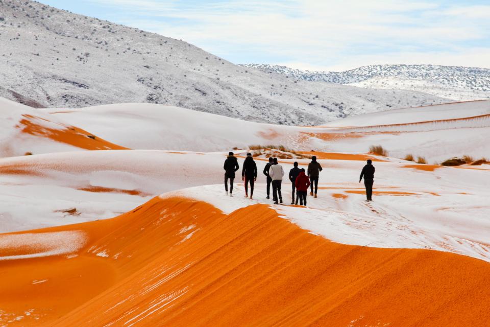 snow on sahara sand dunes