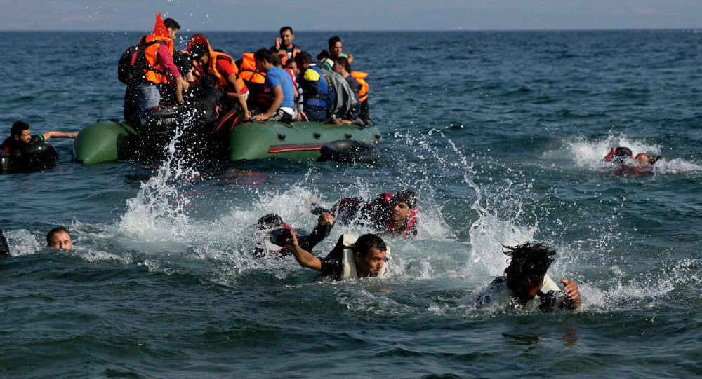 migrants in the water and boat crossing into greece