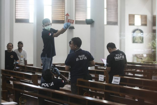 Forensics on sight following church attack by sword maniac