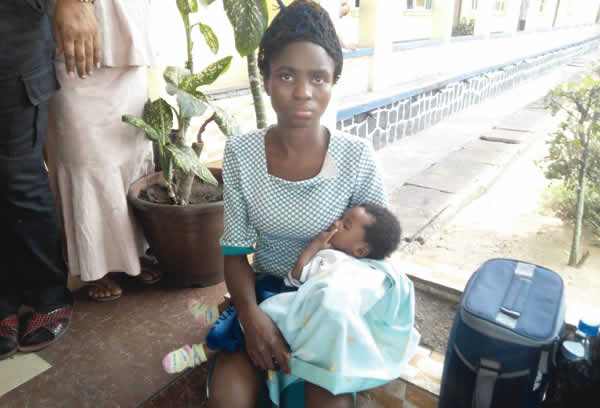 rita nwolu with her baby