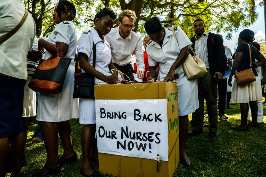 People cast their letters of complaint to Zimbabwe deputy President Chiwenga among nurses who had gathered at Unity Square in Harare on April 20, 2018 to demonstrate their discontent in a #BringBackOurNurses campaign after being summarily dismissed by Zimbabwe Vice President Constantino Chiwenga