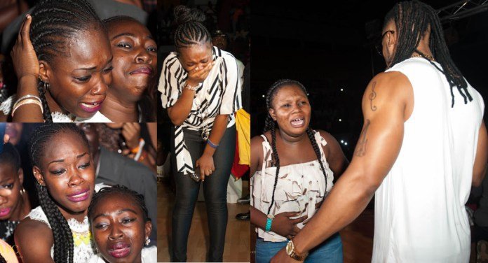fans crying and screaming over Flavour at his concert