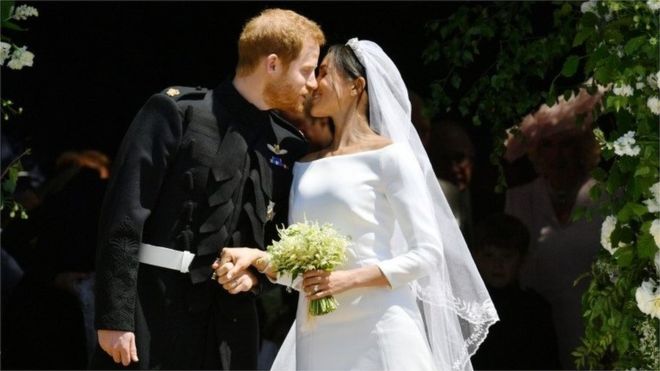 Prince Harry and Meghan Markle share a kiss