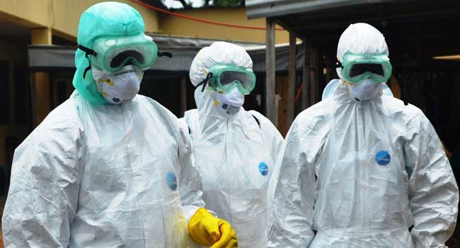 ebola aid workers in hasmat suits