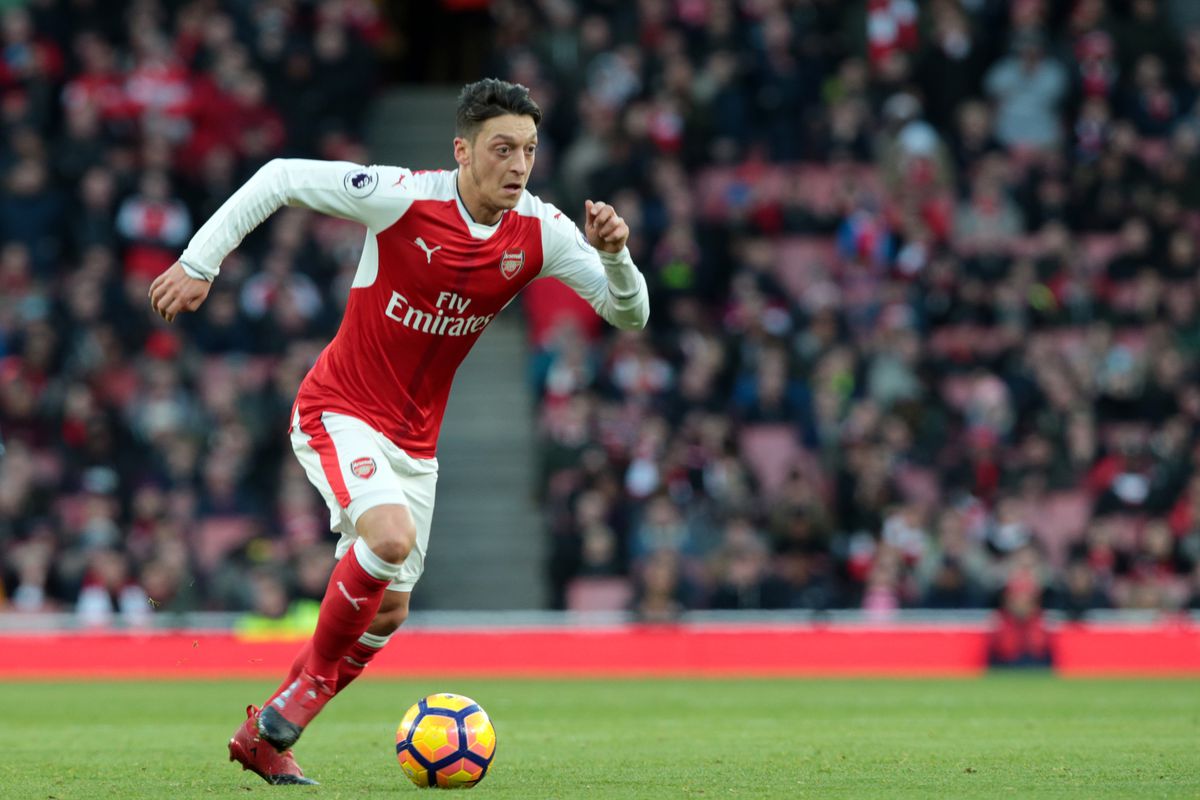 Photo of Ozil running with football