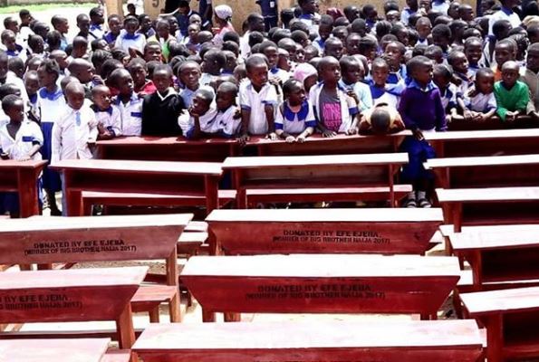 Efe Ejeba donating desks to Primary Schools