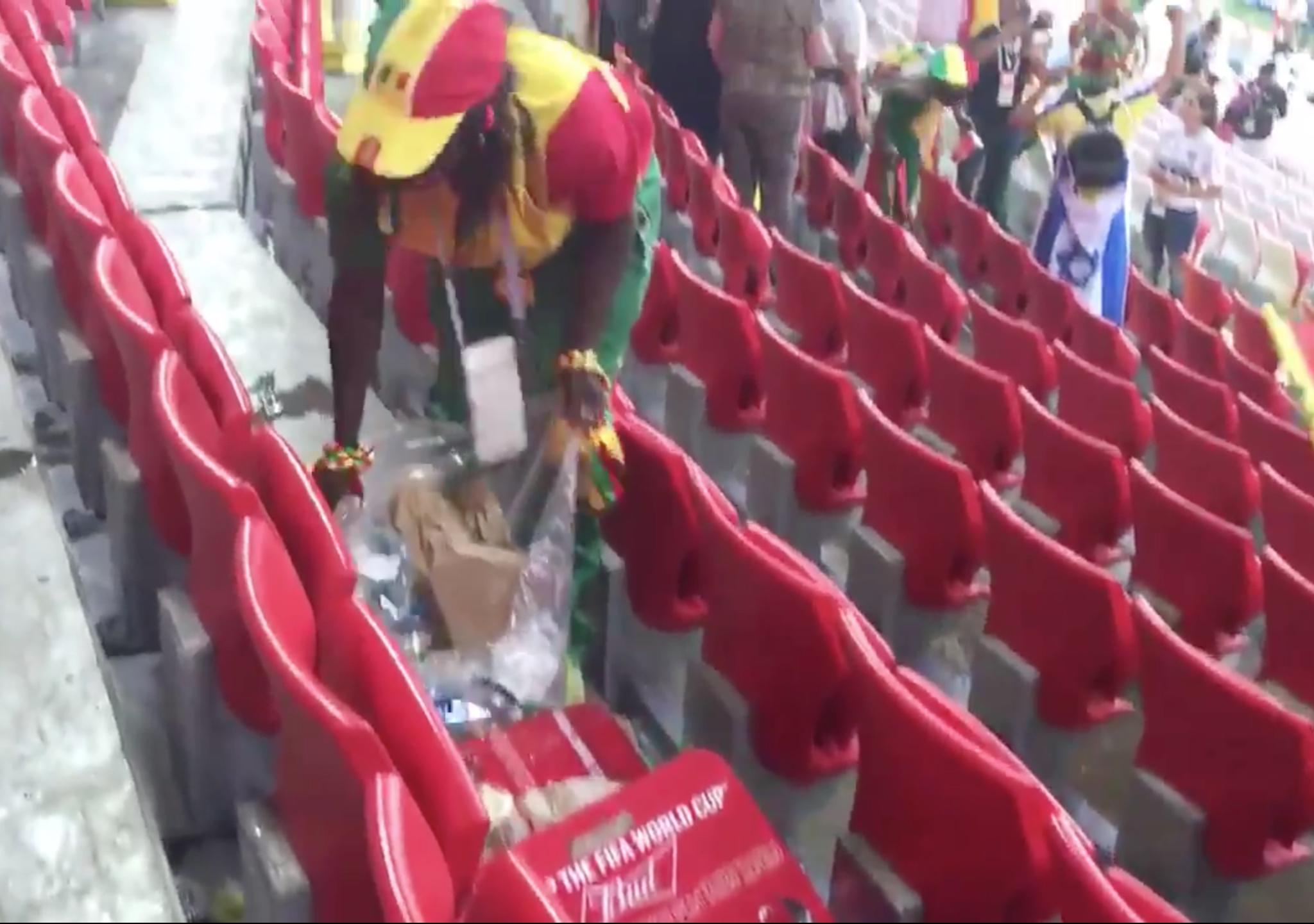 Senegalese fans clean stand