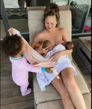 Chrissy Teigen Breastfeeds Baby Doll