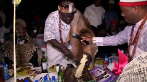 Chief Julius Osakwe, President of Ohaneze ndigbo South Africa chapter, cutting a roast tuber yam to mark the New Yam Festival (Iriji Ndi Igbo) in South Africa on Sunday, 07/10/2018.