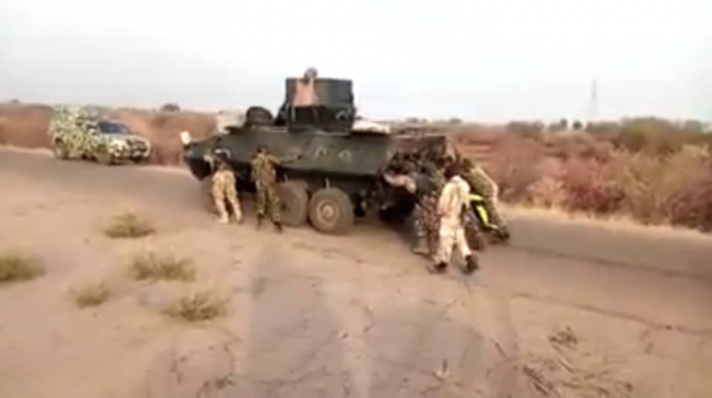 Troops pushing APC