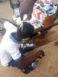 Photos: Police officers cut off young boys’ hair using scissors in Niger