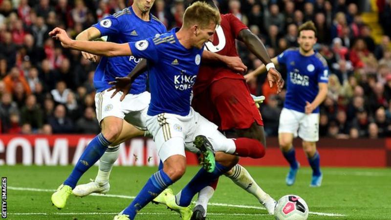Last minute penalty keeps Liverpool firmly on top