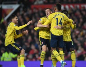 Arsenal move up to fourth with a draw at Old Trafford