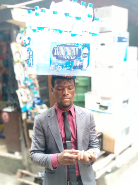 Nigerians Blast For EFCC for Celebrating Unemployed Road Seller Wearing Suit