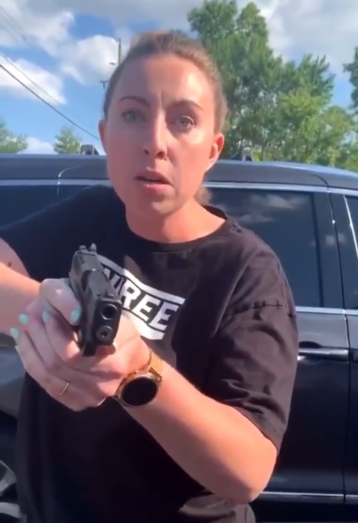 VIDEO: Commotion as White woman pulls Handgun on Black Lady during Clash in parking lot