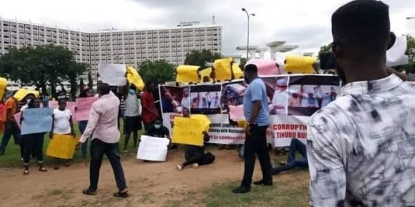 BREAKING: Protesters storm Abuja, demand Tinubu's arrest over 2019 Election Eve Bullion vans in his residence 