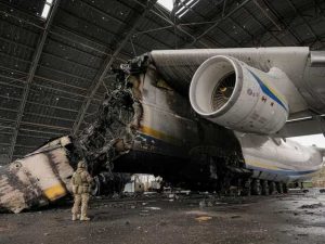 A Ukrainian serviceman observes the Antonov An-225 Mriya aircraft.