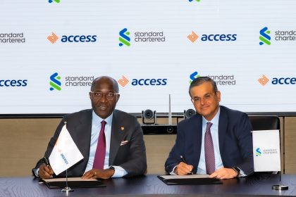 Roosevelt Ogbonna, Group Managing Director, Access Bank Plc, and Sunil Kaushal, Regional CEO, Africa & Middle East, Standard Chartered, at the signing of the agreement