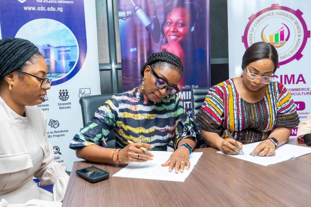 Women entrepreneurs in Nigeria - DG, WCCIMA, Ms. Weyinmi Eribo and Director, EDC, Mrs. Nneka Okekearu signing the agreement